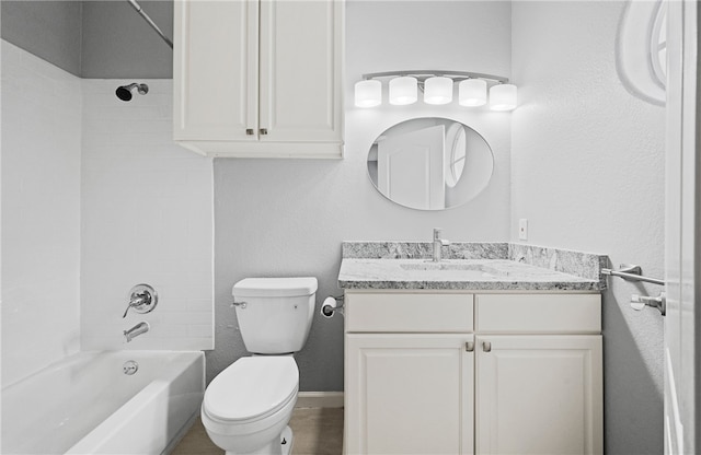 full bathroom with vanity, toilet, and tiled shower / bath combo