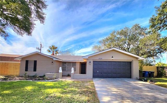 single story home featuring a front yard and a garage