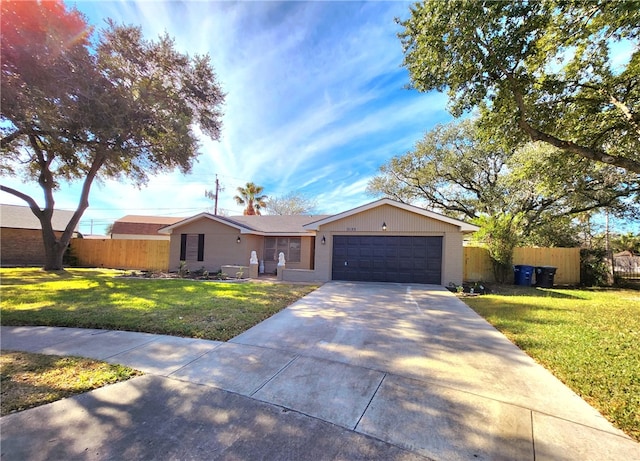 ranch-style house featuring a garage and a front lawn