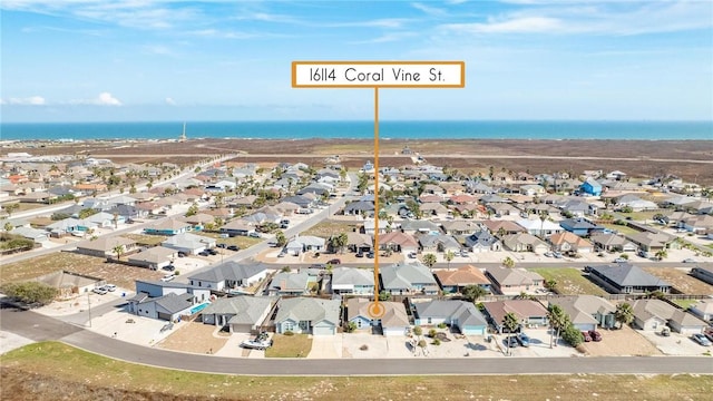 aerial view with a water view and a residential view