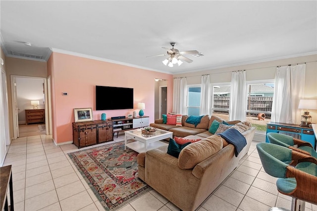 living room with light tile patterned floors, ornamental molding, visible vents, and a ceiling fan