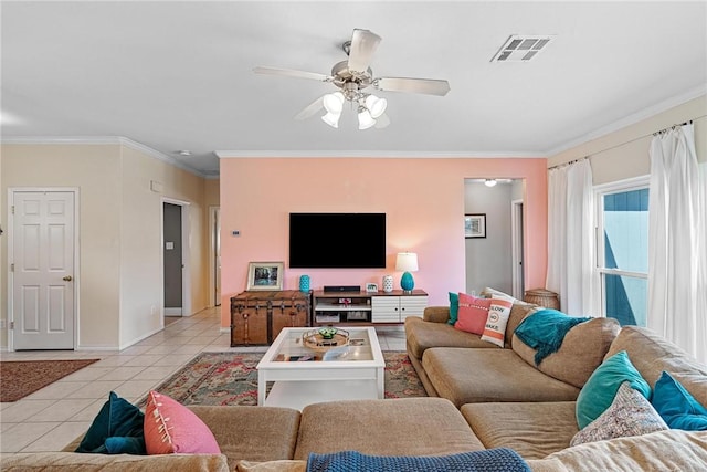 living area featuring light tile patterned floors, visible vents, ornamental molding, and a ceiling fan