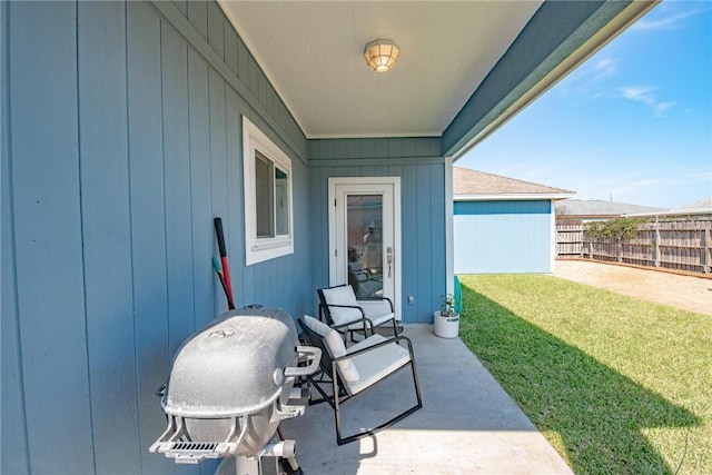 view of patio featuring fence