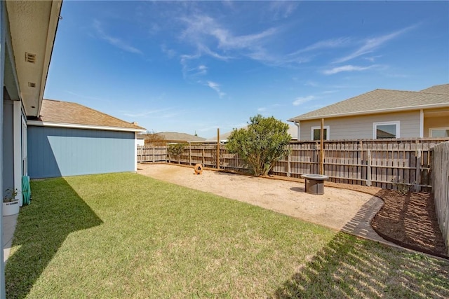 view of yard with a fenced backyard