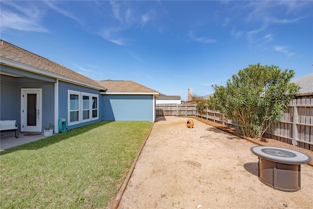 view of yard with a fenced backyard