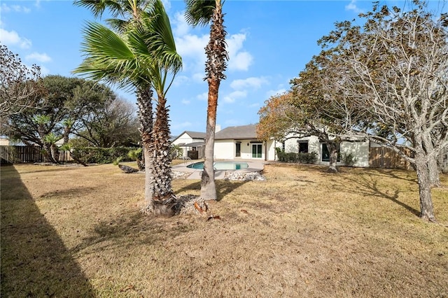 view of yard with a fenced in pool