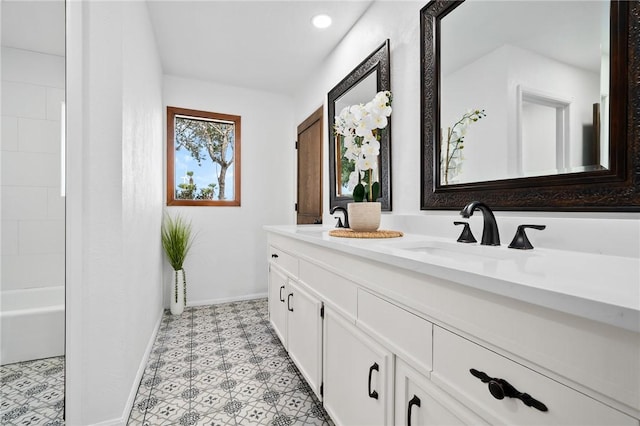 bathroom featuring tile patterned flooring and vanity