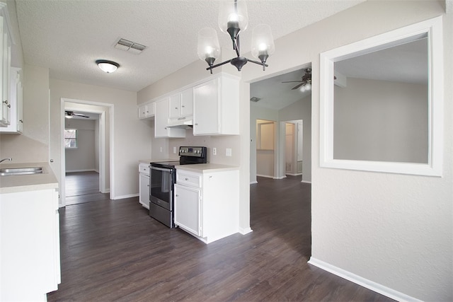 kitchen featuring ceiling fan with notable chandelier, electric range, white cabinets, visible vents, and light countertops
