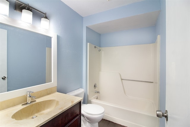 full bath featuring toilet,  shower combination, and vanity
