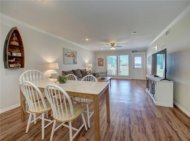 800 Beach Access Road 1a 509, Port Aransas, TX 78373 - dining room featuring ornamental molding, wood finished floors, baseboards, ceiling fan, and recessed lighting