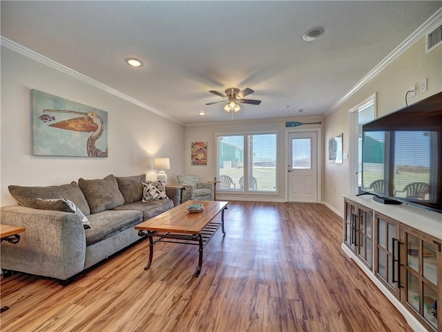 800 Beach Access Road 1a 509, Port Aransas, TX 78373 - living area featuring a ceiling fan, wood finished floors, crown molding, recessed lighting, and baseboards