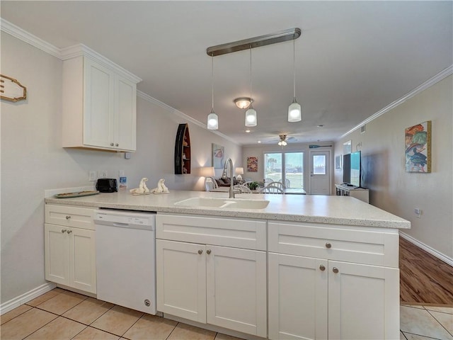 800 Beach Access Road 1a 509, Port Aransas, TX 78373 - kitchen with white dishwasher, a sink, a peninsula, ornamental molding, and white cabinetry