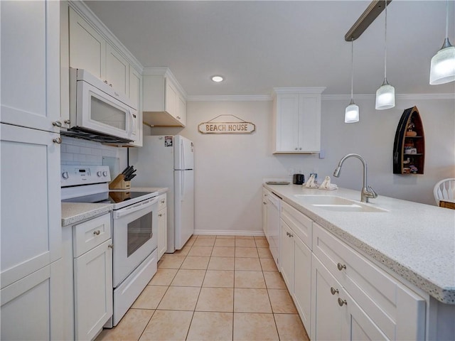800 Beach Access Road 1a 509, Port Aransas, TX 78373 - kitchen featuring white appliances, a sink, white cabinets, a peninsula, and crown molding