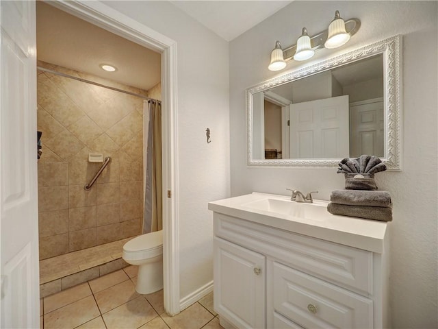800 Beach Access Road 1a 509, Port Aransas, TX 78373 - bathroom featuring a tile shower, vanity, tile patterned flooring, and toilet