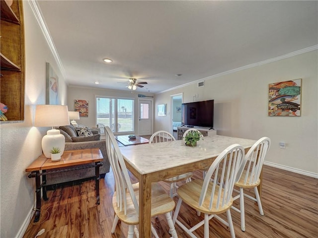 800 Beach Access Road 1a 509, Port Aransas, TX 78373 - dining space with crown molding, baseboards, wood finished floors, a ceiling fan, and recessed lighting