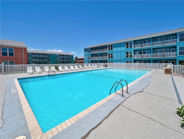 800 Beach Access Road 1a 509, Port Aransas, TX 78373 - community pool with fence and a patio area