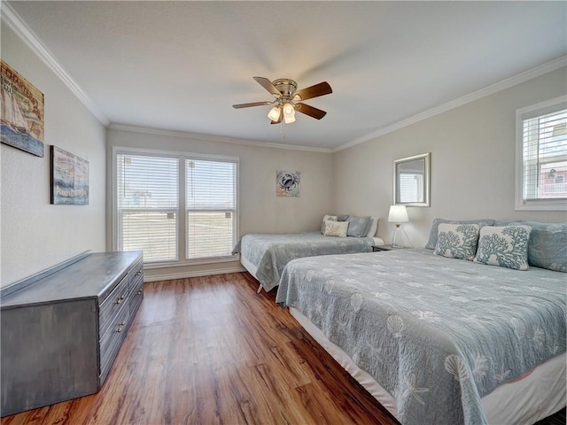 800 Beach Access Road 1a 509, Port Aransas, TX 78373 - bedroom featuring wood finished floors, ornamental molding, and a ceiling fan