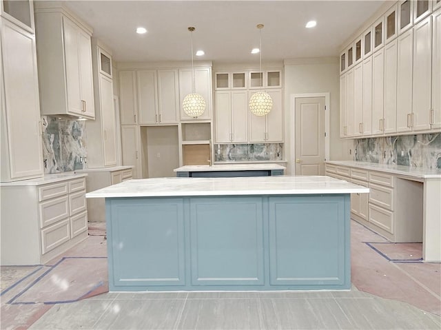 13817 Hawksnest Bay Dr, Corpus Christi, TX 78418 - kitchen with a center island, tasteful backsplash, glass insert cabinets, and recessed lighting