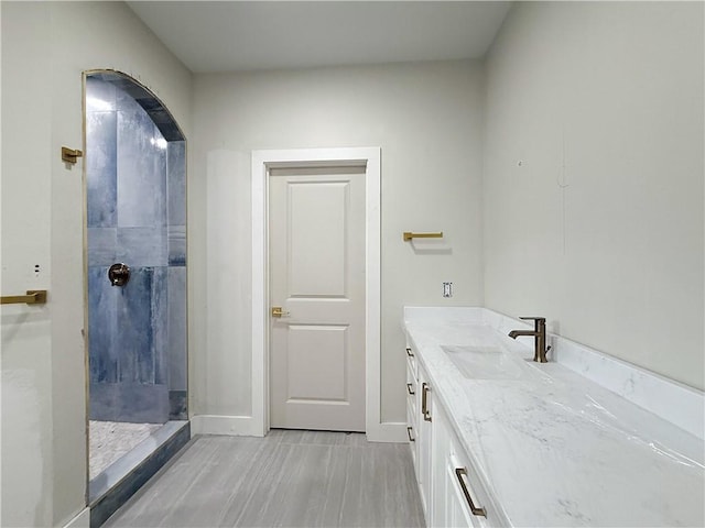 13817 Hawksnest Bay Dr, Corpus Christi, TX 78418 - full bathroom featuring a walk in shower, vanity, and wood finished floors