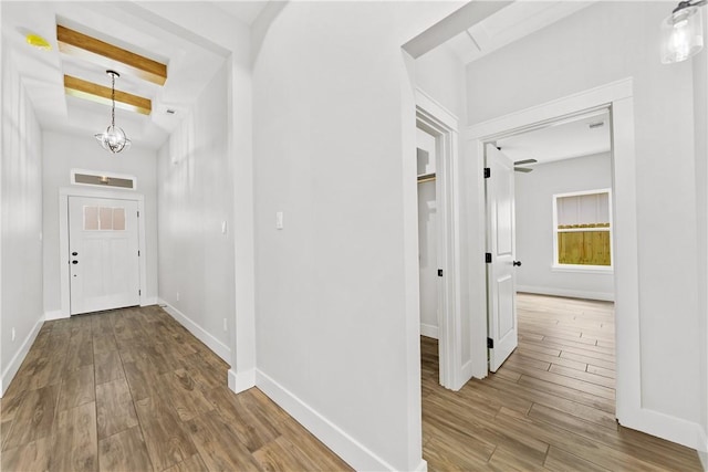 6218 Sadie St, Corpus Christi, TX 78415 - entrance foyer with wood finished floors, a chandelier, and beam ceiling