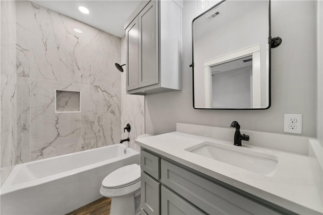 6218 Sadie St, Corpus Christi, TX 78415 - bathroom featuring vanity, shower / washtub combination, wood finished floors, and recessed lighting