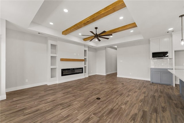 6218 Sadie St, Corpus Christi, TX 78415 - unfurnished living room featuring built in features, dark wood-type flooring, a ceiling fan, recessed lighting, and a glass covered fireplace