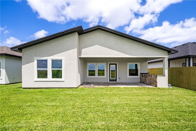 6218 Sadie St, Corpus Christi, TX 78415 - rear view of house with stucco siding, a patio area, and exterior kitchen
