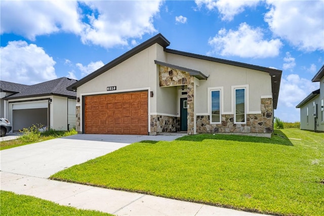 6218 Sadie St, Corpus Christi, TX 78415 - view of front of home with stone siding, an attached garage, concrete driveway, a front lawn, and stucco siding