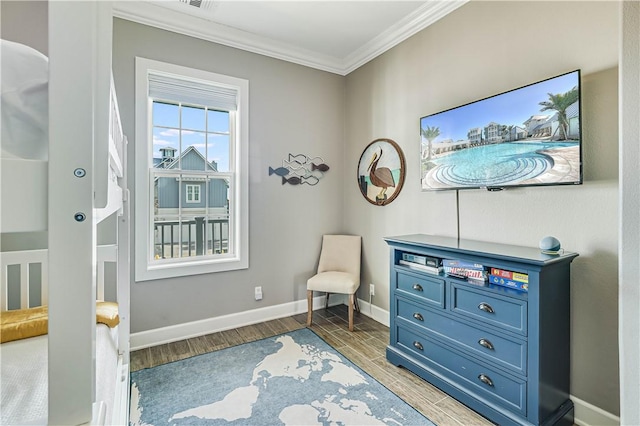 sitting room featuring hardwood / wood-style floors and ornamental molding