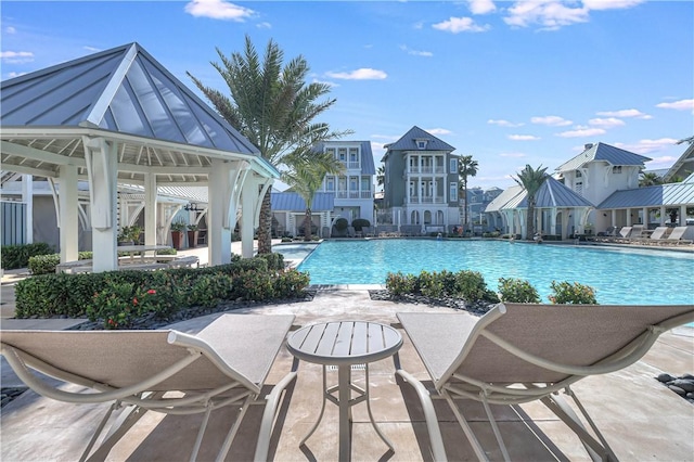 view of swimming pool with a gazebo and a patio area