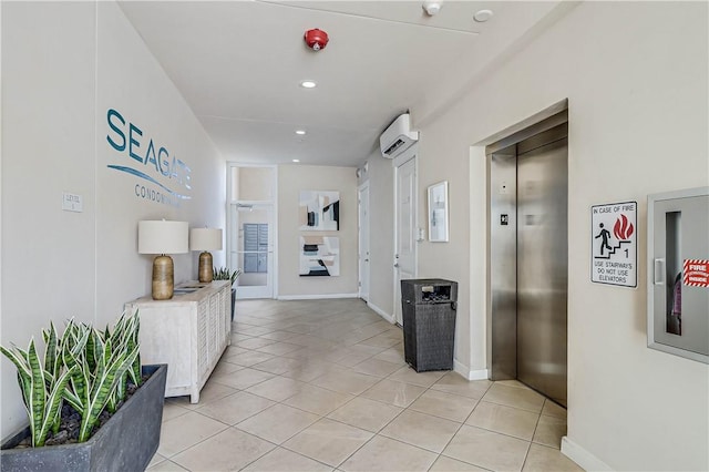 hallway featuring an AC wall unit, elevator, and light tile patterned flooring