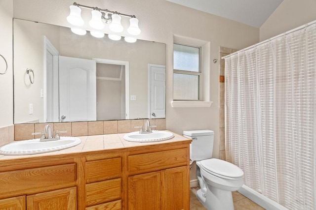 1201 Cline St, Corpus Christi, TX 78418 - bathroom featuring double vanity, toilet, a shower with shower curtain, and tile patterned floors