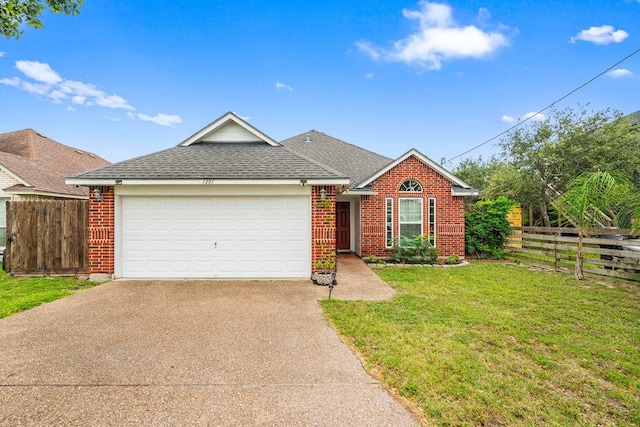 1201 Cline St, Corpus Christi, TX 78418 - view of front of home with brick siding, driveway, a shingled roof, and a garage