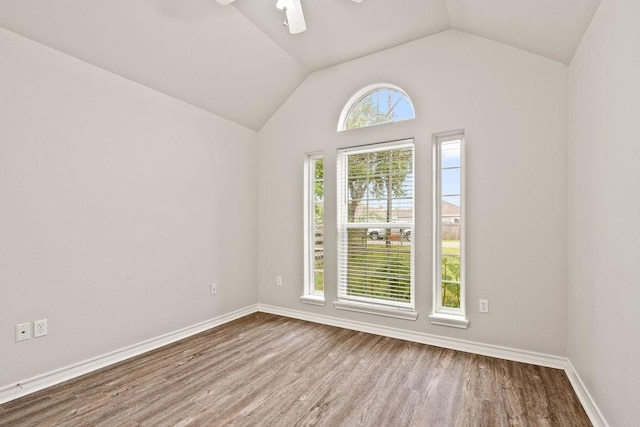 1201 Cline St, Corpus Christi, TX 78418 - empty room with wood finished floors, lofted ceiling, a ceiling fan, and baseboards