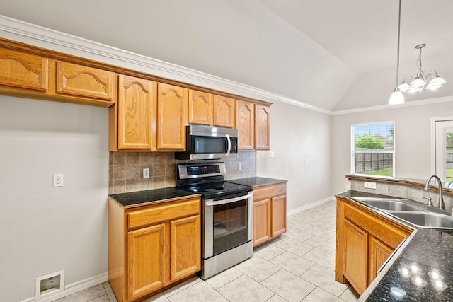 1201 Cline St, Corpus Christi, TX 78418 - kitchen with stainless steel appliances, a sink, dark countertops, decorative backsplash, and vaulted ceiling