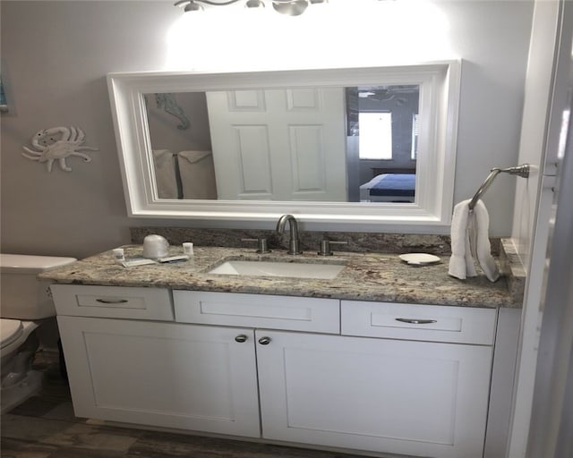 bathroom with vanity and toilet