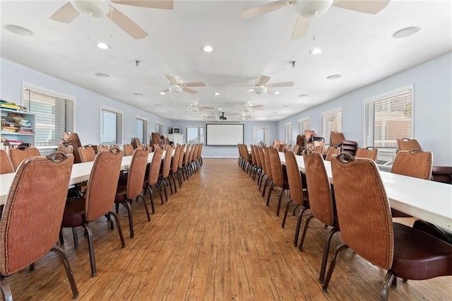 dining space featuring ceiling fan and light hardwood / wood-style flooring