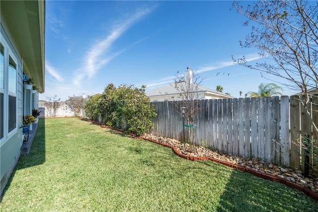 view of yard featuring a fenced backyard