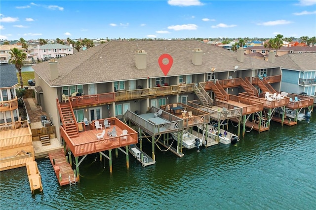 15414 Salt Cay Ct Unit 5E, Corpus Christi, TX 78418 - rear view of property featuring stairway, a residential view, and a deck with water view