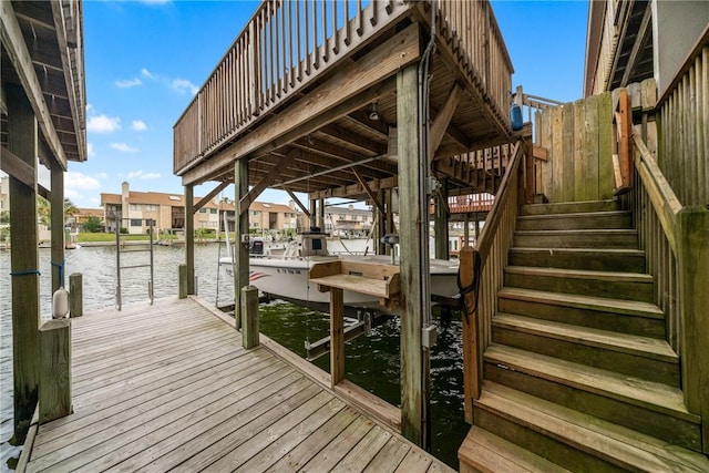 15414 Salt Cay Ct Unit 5E, Corpus Christi, TX 78418 - view of dock with boat lift, a water view, and stairs