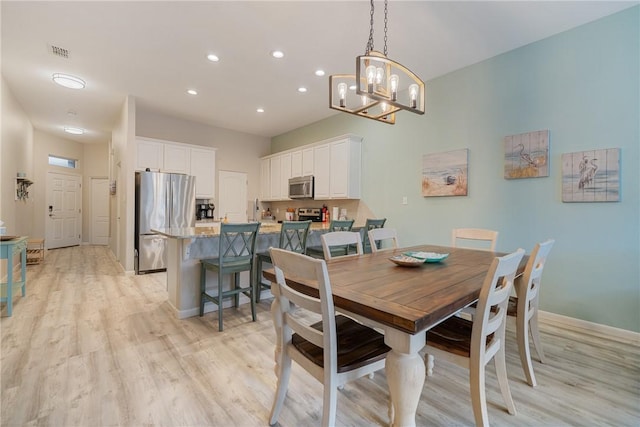 15414 Salt Cay Ct Unit 5E, Corpus Christi, TX 78418 - dining room with light wood-type flooring, recessed lighting, a chandelier, and visible vents