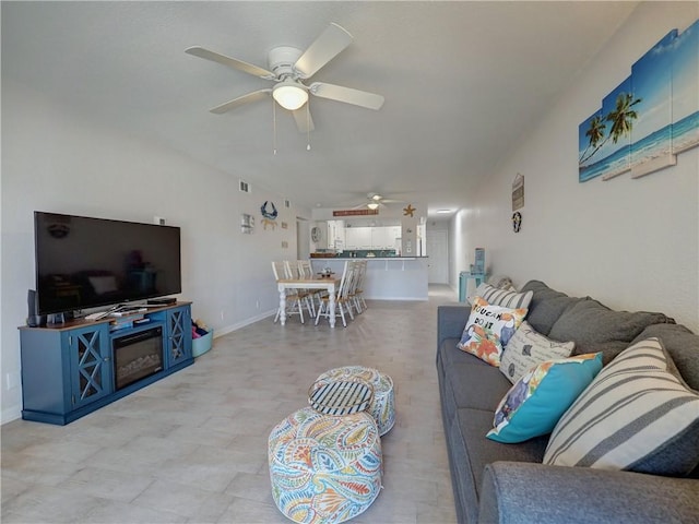5973 State Highway 361 Unit 218, Port Aransas, TX 78373 - living area featuring a ceiling fan and baseboards