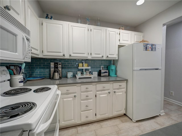 kitchen with tasteful backsplash, white appliances, light tile patterned flooring, and white cabinets