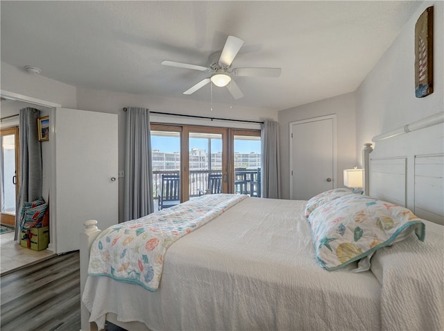 bedroom featuring access to exterior, dark hardwood / wood-style flooring, and ceiling fan