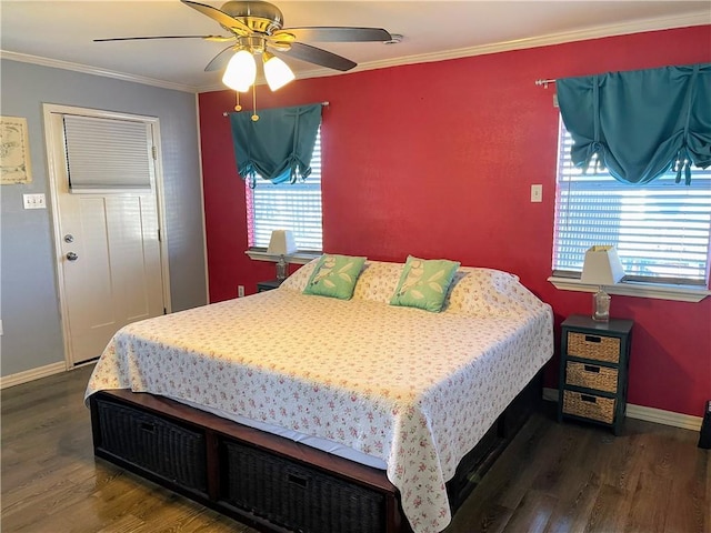 bedroom featuring crown molding, dark wood-type flooring, and ceiling fan