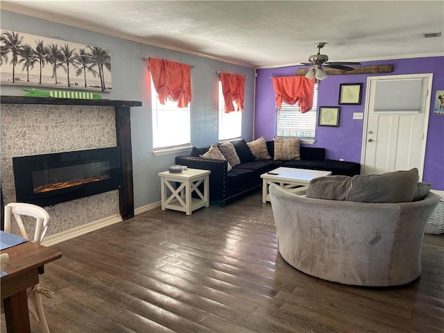 living room with crown molding, dark wood-type flooring, and ceiling fan