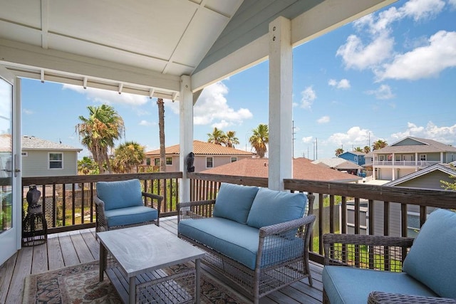 deck with a residential view and an outdoor living space