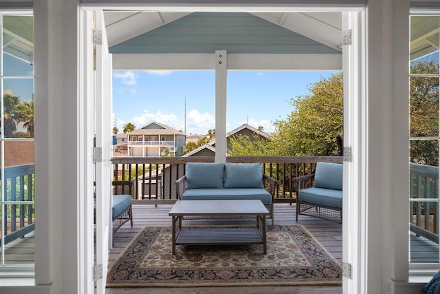 wooden deck featuring an outdoor living space