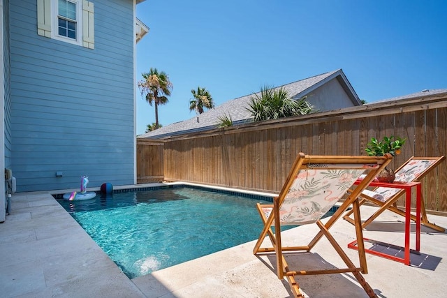 view of pool with a fenced in pool, a patio area, and a fenced backyard