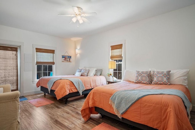 bedroom featuring a ceiling fan and wood finished floors